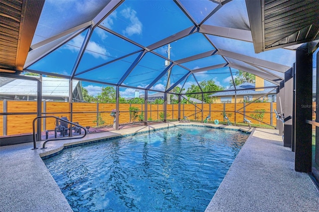 view of pool with a lanai and a patio area