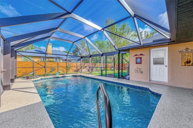 view of pool featuring a patio area and a lanai