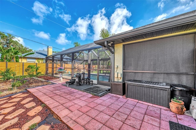 view of patio / terrace featuring a lanai