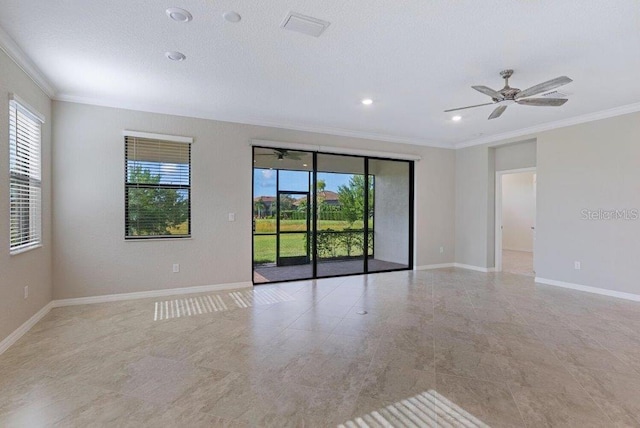 spare room featuring ceiling fan and ornamental molding