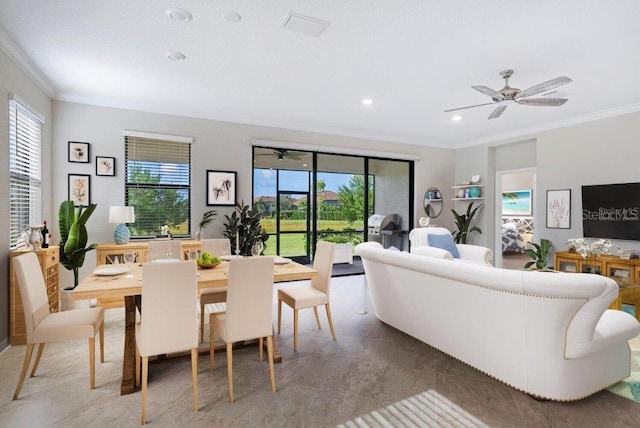 living room featuring tile patterned floors, ceiling fan, and crown molding