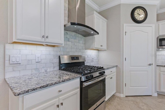 kitchen featuring white cabinetry, wall chimney exhaust hood, light stone counters, and appliances with stainless steel finishes