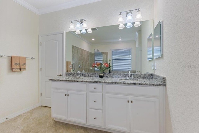 bathroom featuring a shower, vanity, ornamental molding, and tile patterned flooring