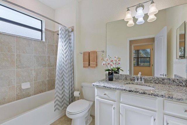 full bathroom with tile patterned flooring, vanity, shower / bath combo, and toilet