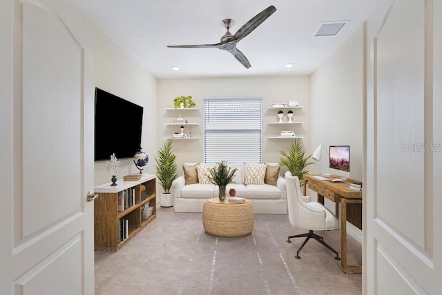 carpeted office featuring ceiling fan