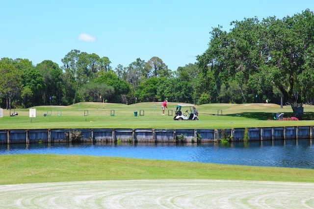 surrounding community featuring a yard and a water view