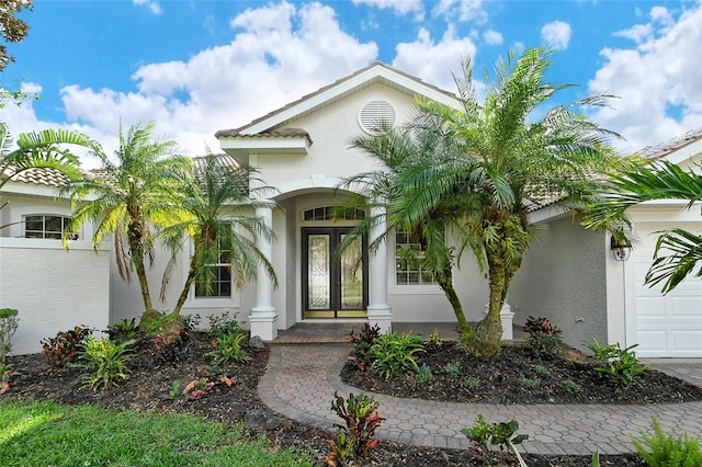 view of exterior entry featuring a garage