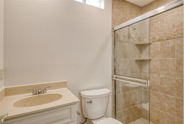 bathroom with toilet, walk in shower, and vanity