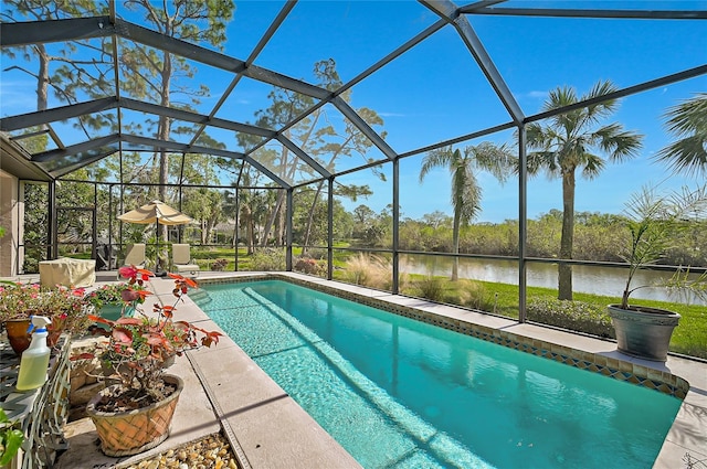 view of pool with a lanai, a water view, and a patio