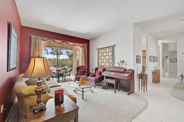 sitting room with light tile patterned floors and a textured ceiling