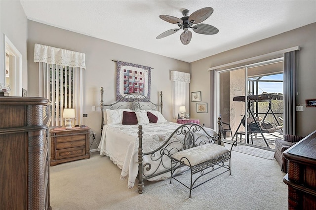 bedroom with access to exterior, light carpet, a textured ceiling, and ceiling fan