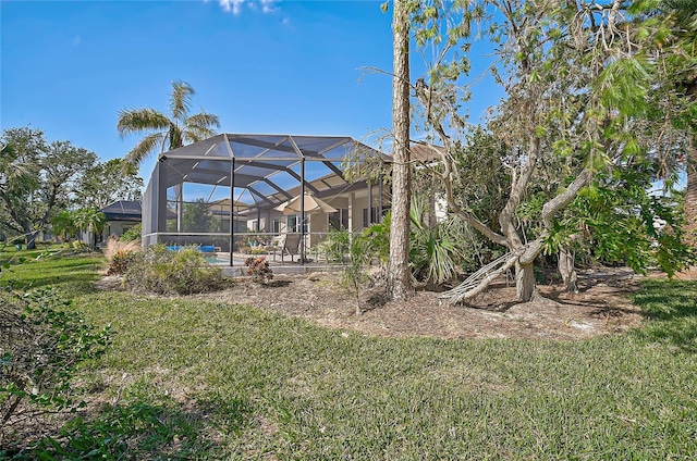 view of yard featuring glass enclosure