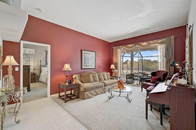 living room featuring a textured ceiling and light colored carpet