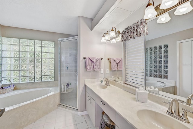 bathroom featuring tile patterned floors, vanity, and independent shower and bath