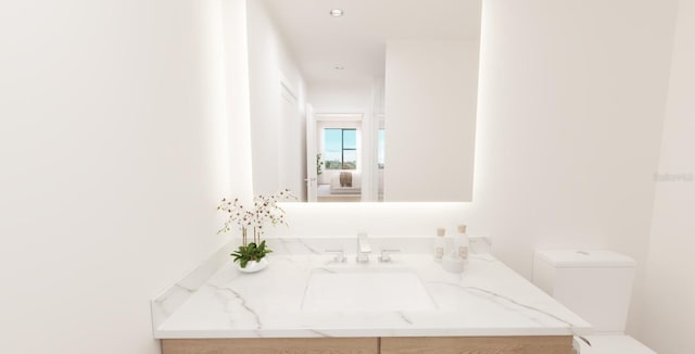 bathroom with vanity and toilet