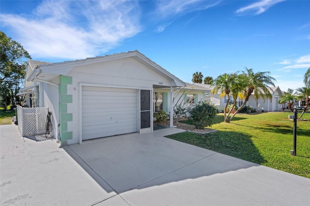 ranch-style home with a front yard and a garage