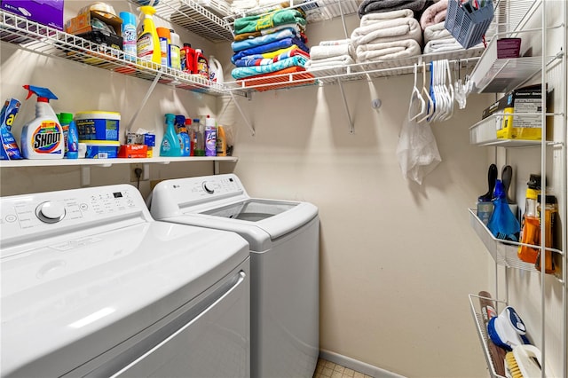 washroom with washing machine and clothes dryer