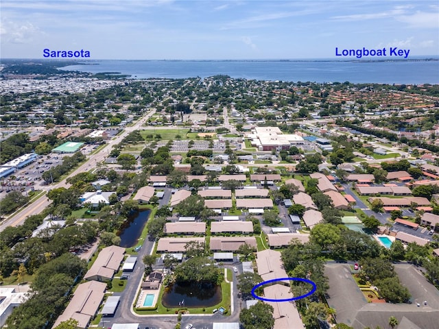 birds eye view of property with a water view