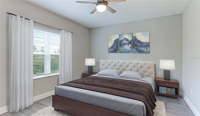 bedroom with light hardwood / wood-style flooring and ceiling fan