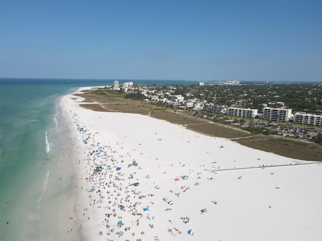 bird's eye view with a water view and a view of the beach