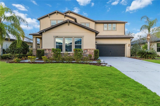 view of front of property featuring a front lawn and a garage