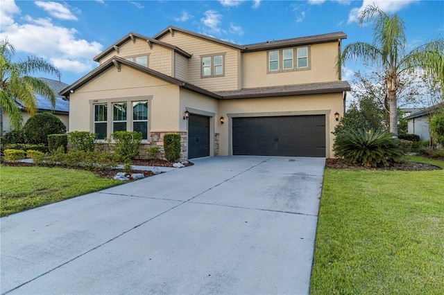 13148 Bliss Loop, Bradenton, FL 34211 - view of front facade featuring a garage, stucco siding, driveway, a front lawn, and stone siding