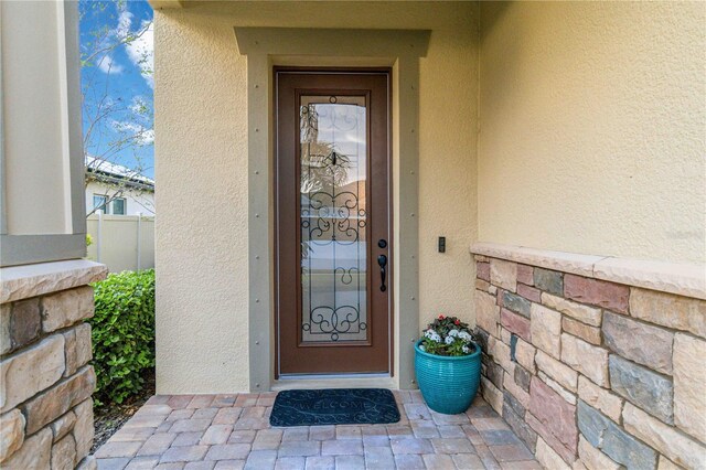 13148 Bliss Loop, Bradenton, FL 34211 - view of exterior entry featuring stucco siding