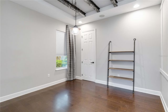 empty room featuring dark wood-type flooring