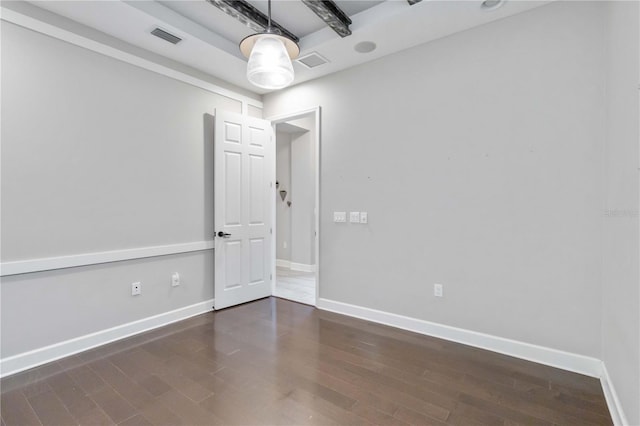 empty room with dark wood-type flooring