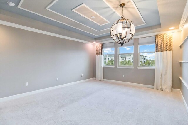 13148 Bliss Loop, Bradenton, FL 34211 - unfurnished room with a raised ceiling, a chandelier, carpet floors, ornamental molding, and baseboards