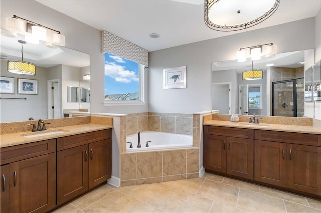 13148 Bliss Loop, Bradenton, FL 34211 - full bath featuring a shower stall, two vanities, a garden tub, and tile patterned floors