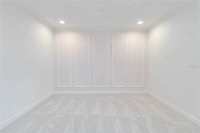 carpeted empty room featuring ornamental molding