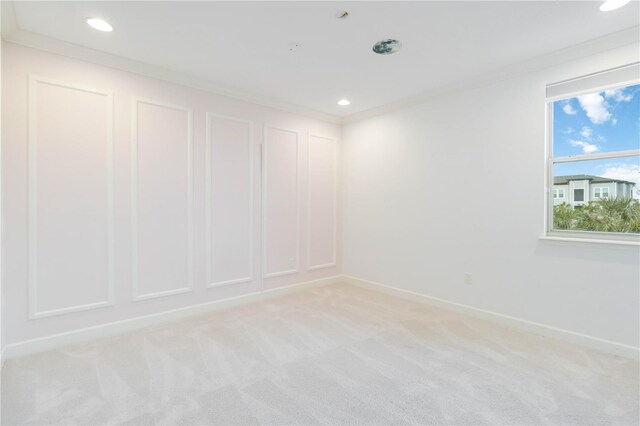 13148 Bliss Loop, Bradenton, FL 34211 - spare room featuring crown molding, baseboards, light colored carpet, and recessed lighting