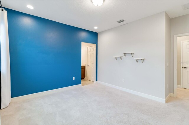 13148 Bliss Loop, Bradenton, FL 34211 - unfurnished room featuring light carpet, baseboards, and recessed lighting