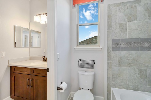 full bathroom featuring vanity, toilet, and tiled shower / bath