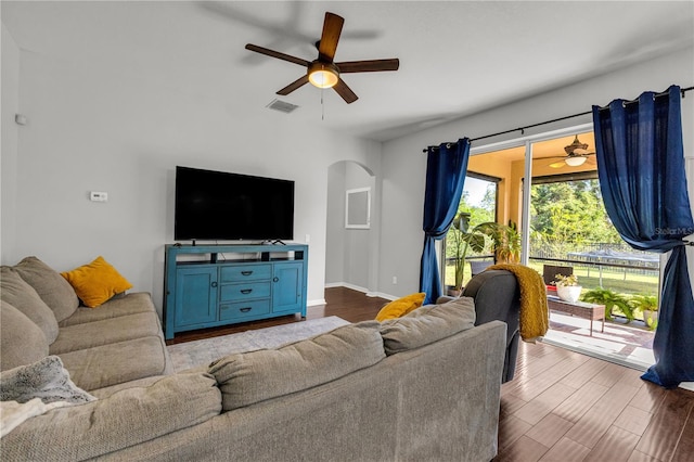 living room with ceiling fan and light hardwood / wood-style flooring