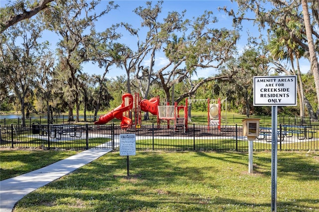 view of play area featuring a lawn