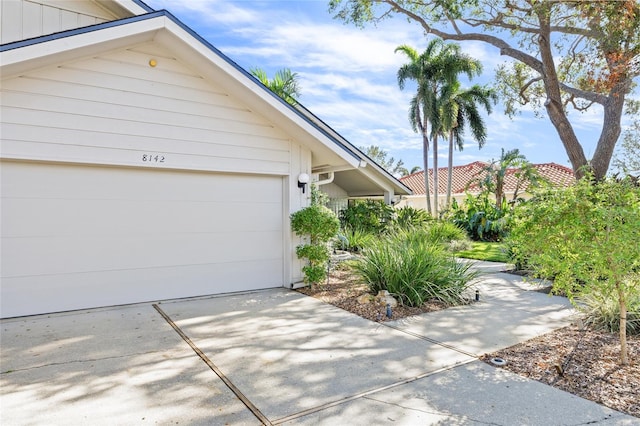 view of side of property with a garage