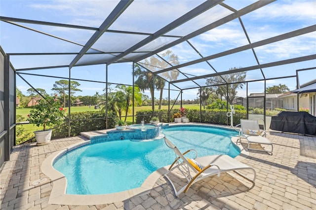 view of swimming pool featuring a lanai, an in ground hot tub, and a patio