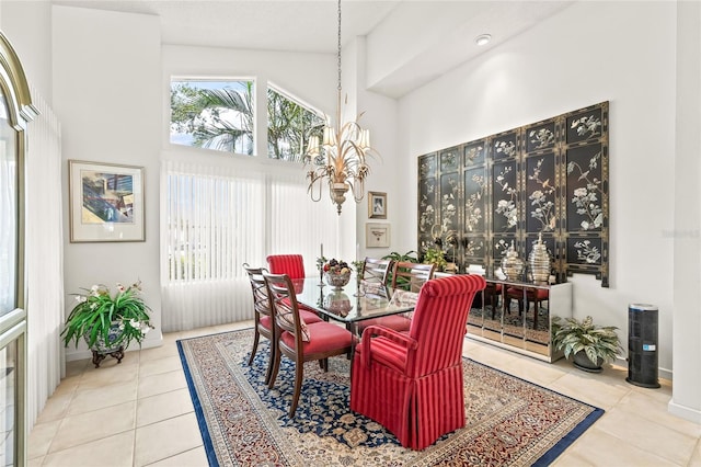 dining space featuring tile patterned floors and high vaulted ceiling