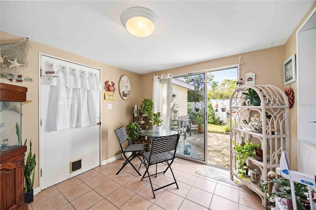 dining space with light tile patterned floors