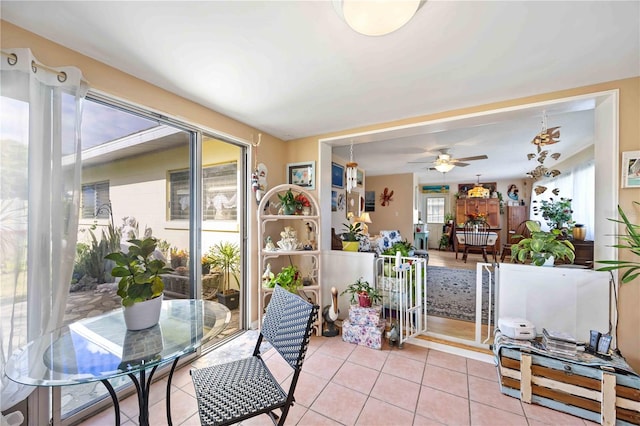 sunroom / solarium with ceiling fan