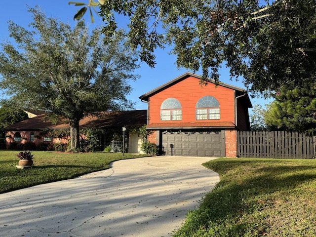 front of property with a garage and a front lawn