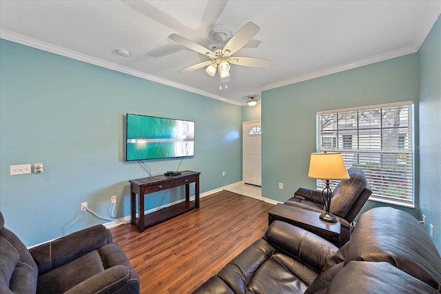 living room featuring hardwood / wood-style flooring, ceiling fan, and ornamental molding