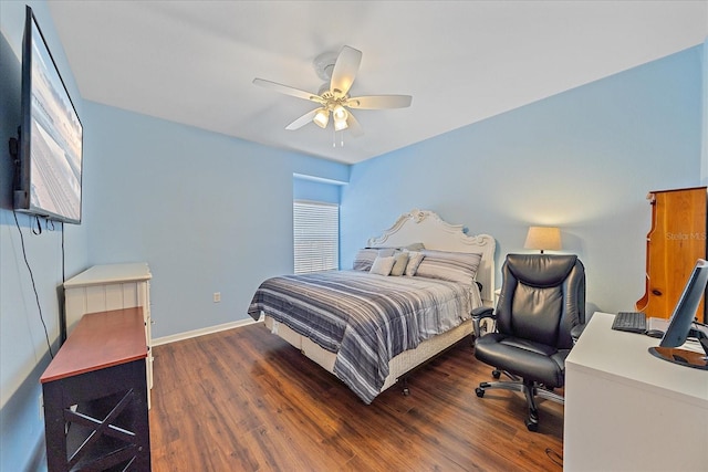 bedroom with ceiling fan, dark hardwood / wood-style flooring, and multiple windows