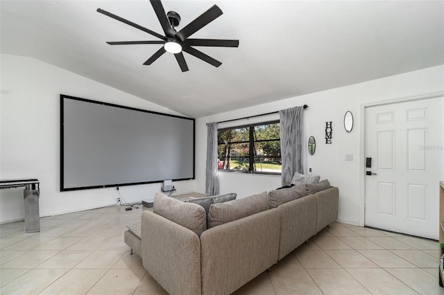 tiled cinema room featuring vaulted ceiling and ceiling fan