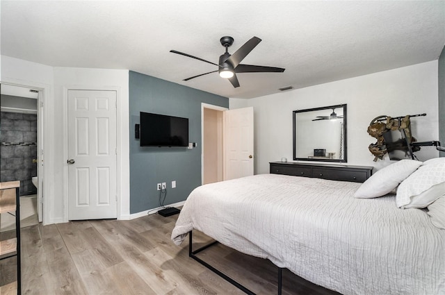 bedroom with ceiling fan and hardwood / wood-style floors