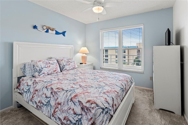 bedroom with light carpet, a textured ceiling, and ceiling fan