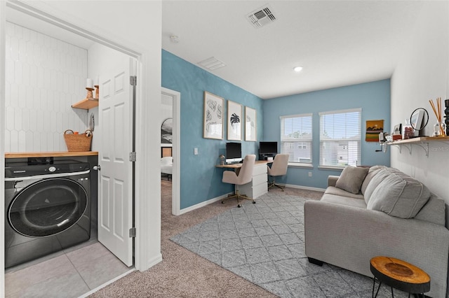 interior space with washer / dryer and light colored carpet