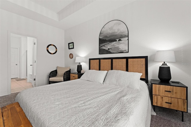 carpeted bedroom featuring connected bathroom